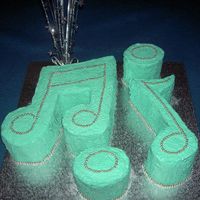 Music Notes Butter cake with butter cream icing. Silver cachous on top and side.