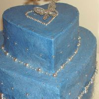 Blueheart.jpg Butter cream icing on a butter cake. The butterflies are metal.