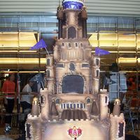 Castle Cakw Ok this is a bigger cake picture. Cake is 6ft. + tall. all is cake except bottom tier and columns. Made for a 60th birthday party