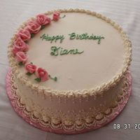 Ladies Birthday Cake 10" round, iced in IMBC with piped side embroidery and pink roses.
