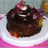 Chocolate-Chocolate Cake With Jello Flowers This is a cake I made for a friend's birthday party. It's a chocolate cake with fudge filling and chocolate icing (she loved...