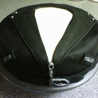 1027072008.jpg Chocolate Kalhua cake (10 inch) with black fondant jacket, white foundant shirt, and accents painted in luster dust. Thanks to pyxxydust...