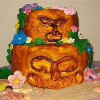 Tiki Cake The Tikis are carved cake covered in fondant and painted, the flowers are all foundant