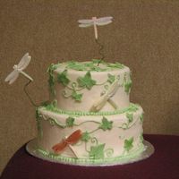 Dragonfly Cake Fondant covering (over cake dummy) and fondant leaves with royal icing ivyChocolate dragonflys (from mold) with shimmer dust. Made at Cake...