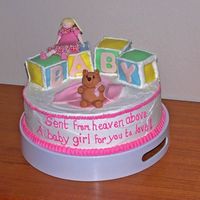 Baby Shower - Girl And Bear With Blocks My first fondant figures!! It is a 12 inch white cake with lemon cured filling and butter cream frosting. The blocks are cake covered in...