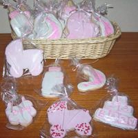 Baby_Shower_Cookies.jpg No Fail Cookies and Royal Icing made for a baby shower. The pram has pink sandy sugar or small hearts and the moon is stamped on to the...