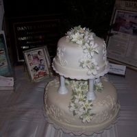 My First Wedding For Cake Class Graduation 1/14/04 This was my first Wedding Cake I made for my last class at Wilton classes. I chose a 2 tier round cake. Bottom is 10 inches and top is 6...
