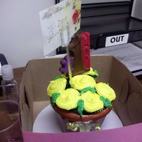 Mother's Day Yellow Mini Cupcake Bouquet This is my first attempt at make one, my daughter helped me with making the chocolate suckers. I made about six pots for a couple of mother...