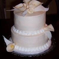 Bridal Shower Cake Ivory and white combo bridal shower cake. First attempt at making calla lilies and ribbon roses out of fondant. Leaves are fondant too....