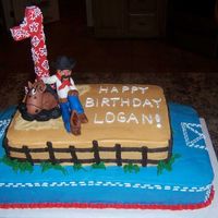 Cowboy Cake - 1St Birthday Cowboy theme birthday cake for 1 year old. Frosted in buttercream. My DH made the fondant figures.