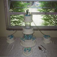 Swan Song Wedding Cake This is an all buttercream cake. The front 6" heart is the one they saved for their first anniversary. I did this one for my niece&#...