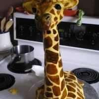 Giraffe French Vanilla-Kahlua cake w/ mocha b/c filling, covered in fondant. Hand-painted, head and neck are carved styrofoam.