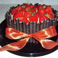 Strawberries & Chocolate Cake I made a chocolate cake with chopped strawberries & custard cream filling. Decorated it with Oreo Milk Straws.