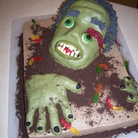 Zombie Rice krispy treat head and hands covered in fondant