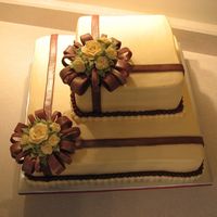 Ivory/burgundy Bridal Shower This is my version of a Wilton design from the 2010 yearbook. Almond buttercream icing, fondant accents, with gold luster dust.