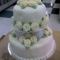 Round Pillar Wedding Cake This cake was made with round pillar separators. The roses are royal icing, the icing is rolled marbelized fondant and the boarder is with...