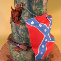 Camo Wedding Cake The bride herself called it her redneck wedding cake :) 6/8/10 inch cakes with fondant shotgun, leaves and flag, the deer was a model toy...