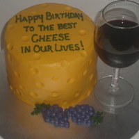 Cheese And Wine 6 inch cake with all buttercream, including the grapes. The wine glass is real, I just filled it with colored Jello instead of liquid.