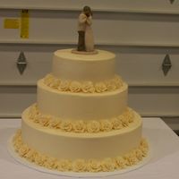 Round Wedding Wedding cake for a very good friend of mine, it came out of the Wilton wedding book, but she didnt want the dots on her cake. Bottom two...