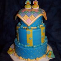 100_3710.jpg This is a baby shower cake that I did for a friend of mine's daughter. Sorry I didnt ask to use it but this is my take on the "...