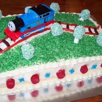 Thomas The Tank Engine Cake This was made for stepson for his third birthday who is crazy for Thomas! The railroad "tracks" are made from Stringers and the &...