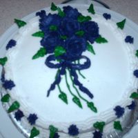 My Final Course Cake The rose are dark purple, but they look blue in the picture.I have some practicing to do with the roses. My instructor helped me out with...