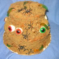 Spooktacular Spice Cake A Pumpkin Spice Cake with cream cheese frosting made to look like something thrown together by an Adam's Family Chef