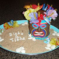 Tiki Engagement Party Cake This was a fun one to make...cake is covered in fondant with fondant accents. Shells and names are white chocolate and used brown sugar for...