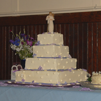 Sqaure Wedding Cake White cake with buttercream frosting.