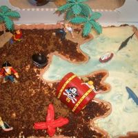 Pirate Treasure A YELLOW CAKE WITH CHOC. BC AND COVERED WITH STABLIZED WHIPPING CREAM. THIS WAS FOR MY 4 YEAR OLD'S BIRTHDAY