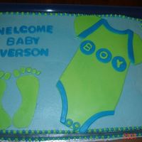 Onesie Baby Shower Cake was disappointed in this one, dont ask me why I made such huge feet. It was for a family member and they still loved it....
