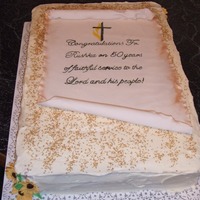 Priest 50Th Anniversary Cake carrot cake iced with crusting cream cheese icing. Gumpaste flowers on corners & parchment scroll done with gumpaste and antiqued with...