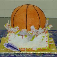 Basketball Splash Cake Okay, it didn't quite turn out the way it was in my imagination. I wanted it to look like a basketball had landed on/ruined a birthday...