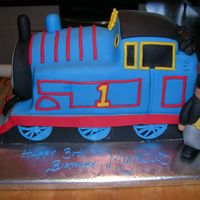 Thomas Side View This is the side of the cake showing the Fat Controller, or Sir Topham Hatt. He was about 7 inches tall and was made from fondant.