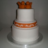 Orange Beauty This is a dummy cake I made to practice the bird toppers. The birds are polymer clay, and the rest is fondant and ri brush-work.