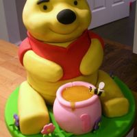 Winnie The Pooh Cake For my daughter's 1st birthday. Vanilla pound cake with strawberry filling and buttercream covered in fondant. It was 12 inches tall...