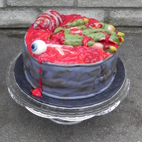 Bucket O' Body Parts A cake for an adult Halloween/Birthday party. Put a red jelly filling in the center of two vanilla rounds. Covered in MMF. Then a layer of...