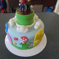 Mario Cake Ii My second Mario Cake, like how this one turned out. MMF for everything. Pipe made out of rice crispy treats and used melted chocolate on...