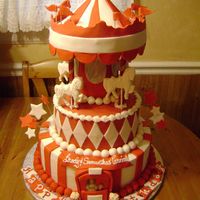 Carousel Cake Customer requested a red and white themed carousel cake. Everything is edible except for the 4 dowels.