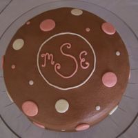 Polka Dot Birthday Cake Peanut butter cake with chocolate buttercream frosing and buttercream dots.