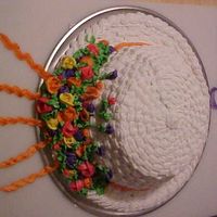 Summer Bonnet For this birthday, my daughter liked my idea of a summer bonnet. The brim is a pizza pan turned over, and the cake was baked in a pyrex...