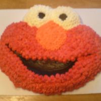 Elmo Cake just a basic yellow cake and buttercream this was my first character cake.