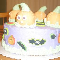 Halloween Cake this is a cake I made for the teachers at my daughters school. I got the idea off of wiltons web site. the pumpkins are balls wrapped with...