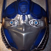 Optimus Prime I call this... Chubby Optimus!! hahaha! This cake was for my Brother's 6th Birthday. I started with a 10" round chocolate fudge...