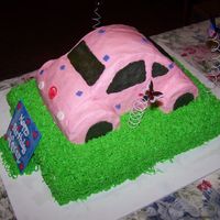 Pink Vw Bug This is a red velvet sheet cake cover with green cream cheese icing to be the grass. The VW Bug is yellow cake covered with pink...