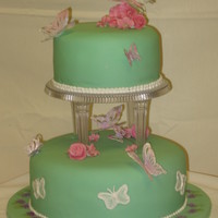 Butterfly Wedding Gum paste butterflies and flowers on seafoam green fondant.