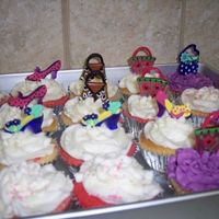 Bratz Cupcakes Here are the cupcakes I made to go with the bratz cake. The picture isn't the greatest. But I got the pic idea from someone else on...