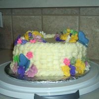 Wilton 2 Final My final cake for the wilton 2 course. The icing has a sortof a yellow color to it because I just a margartia cake recipe and icing flavor...