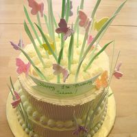 Sahana's Butterflies Gumpaste butterflies and grass on whipped cream cake. This was for a 1st birthday.
