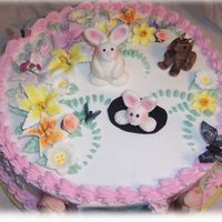 Spring Theme Child Birthday My clients daughter wanted a cake with a bunny, dog, butterflies and a spring theme. Fondant bunnies and dog and edible butterflies and...